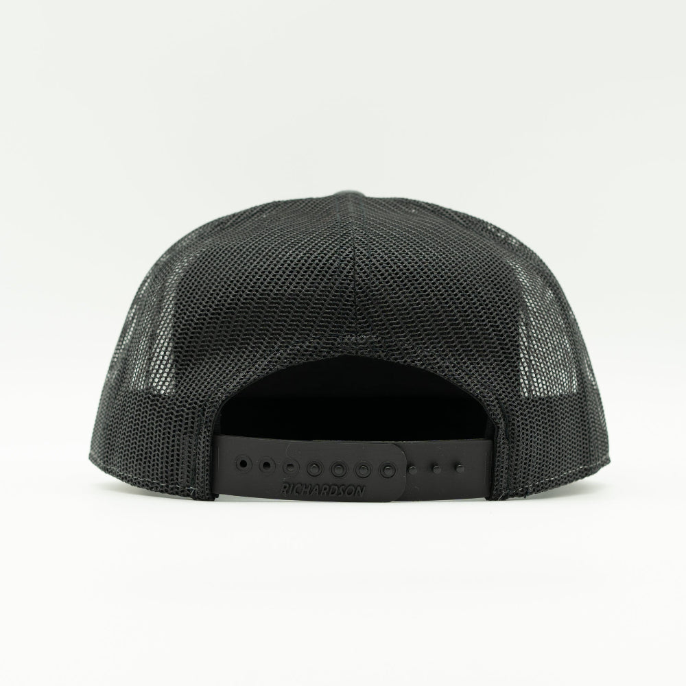 Back view of solid black Richardson 168 Colorado trucker hat showing mesh back and adjustable snapback closure