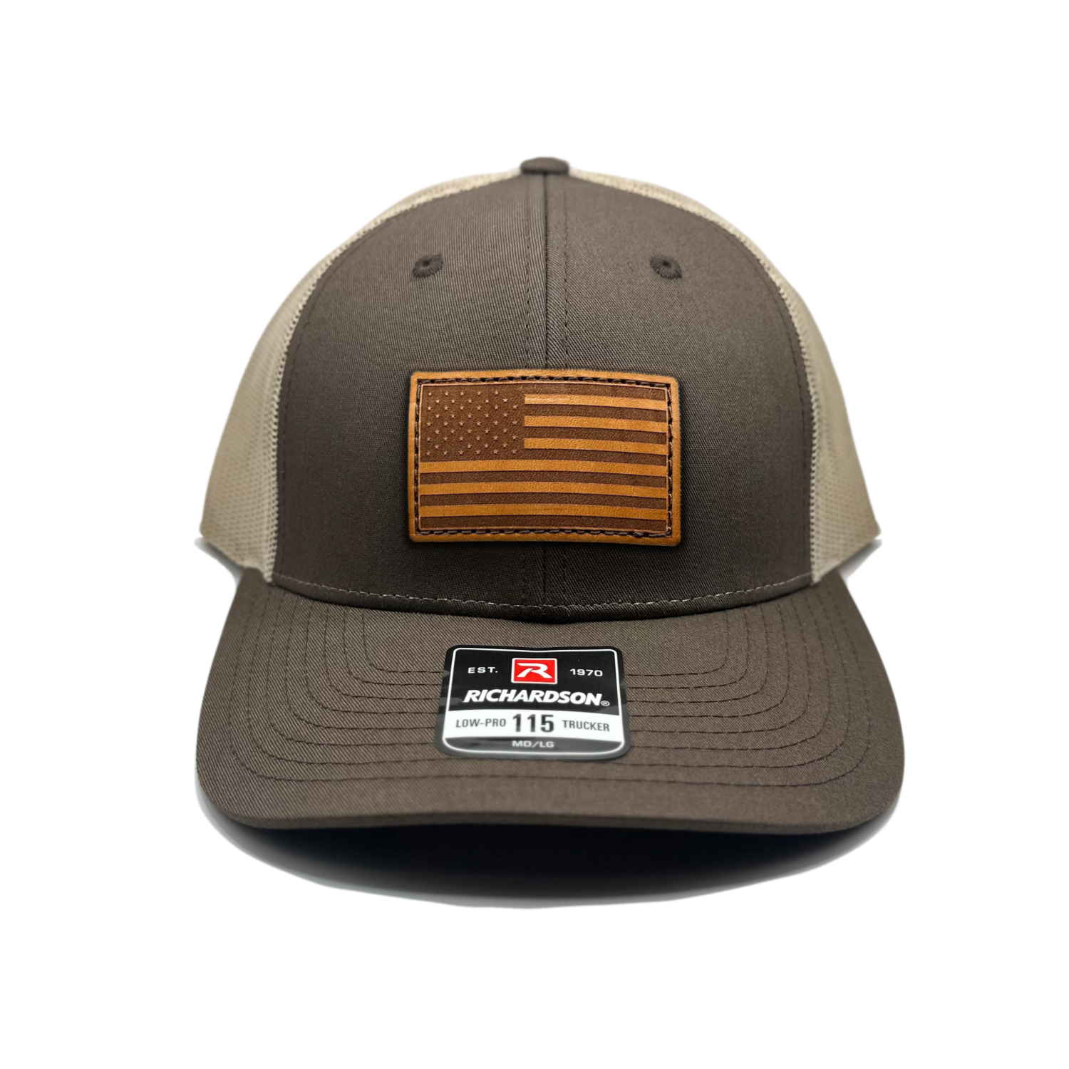 Image of a Brown/Khaki Richardson 115 hat with an American flag patch made of genuine leather, laser engraved and securely sewn onto the hat. The low profile trucker style hat is adjustable to fit small or M/L sizes, offering a versatile and fashionable accessory for any occasion.