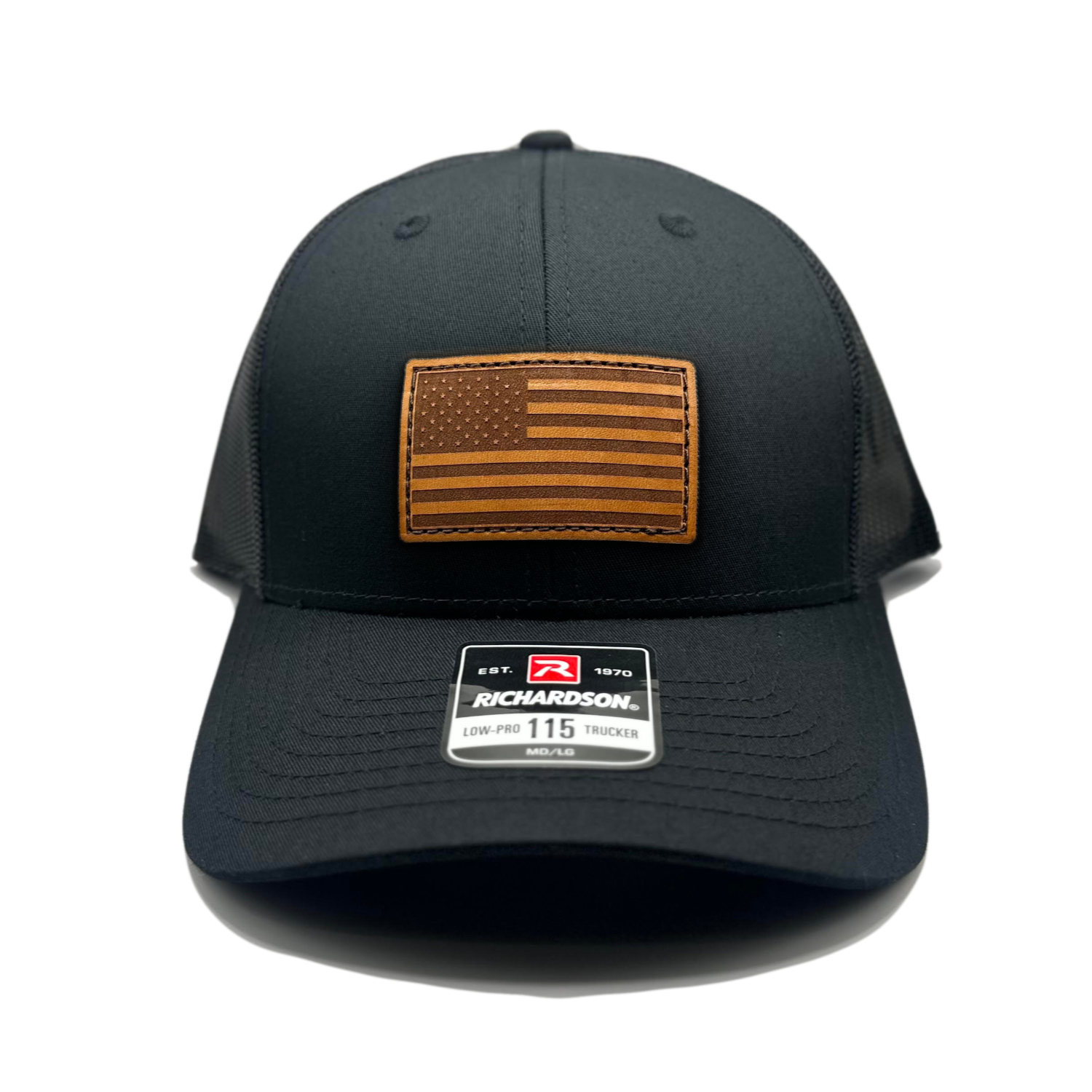 Black Richardson 115 hat featuring a distinctive American flag patch crafted from genuine leather. This unique patch is laser engraved and securely sewn onto the hat. The Richardson 115 is a low profile trucker style hat, adjustable to fit small or M/L sizes, making it a versatile and fashionable accessory for any occasion.