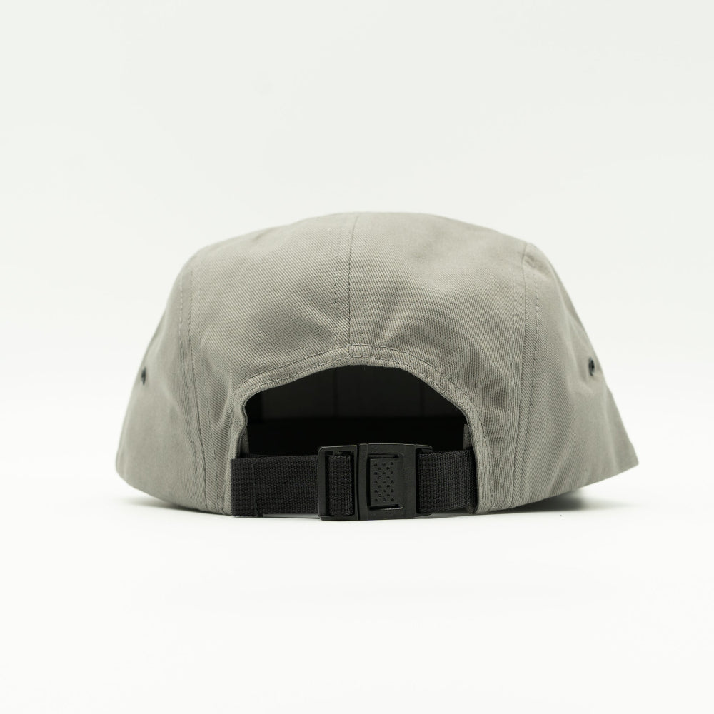 Back view of grey Yupoong 7005 Three Lil Pines hat, showing adjustable strap with buckle and low-profile cotton crown on a flat bill cap.