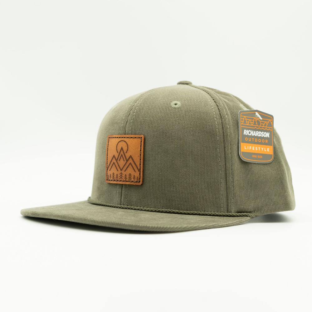 Side view of olive Richardson 253 Moonlite Mountain corduroy rope hat, showing flat bill, high-profile crown, and stitched leather mountain patch.