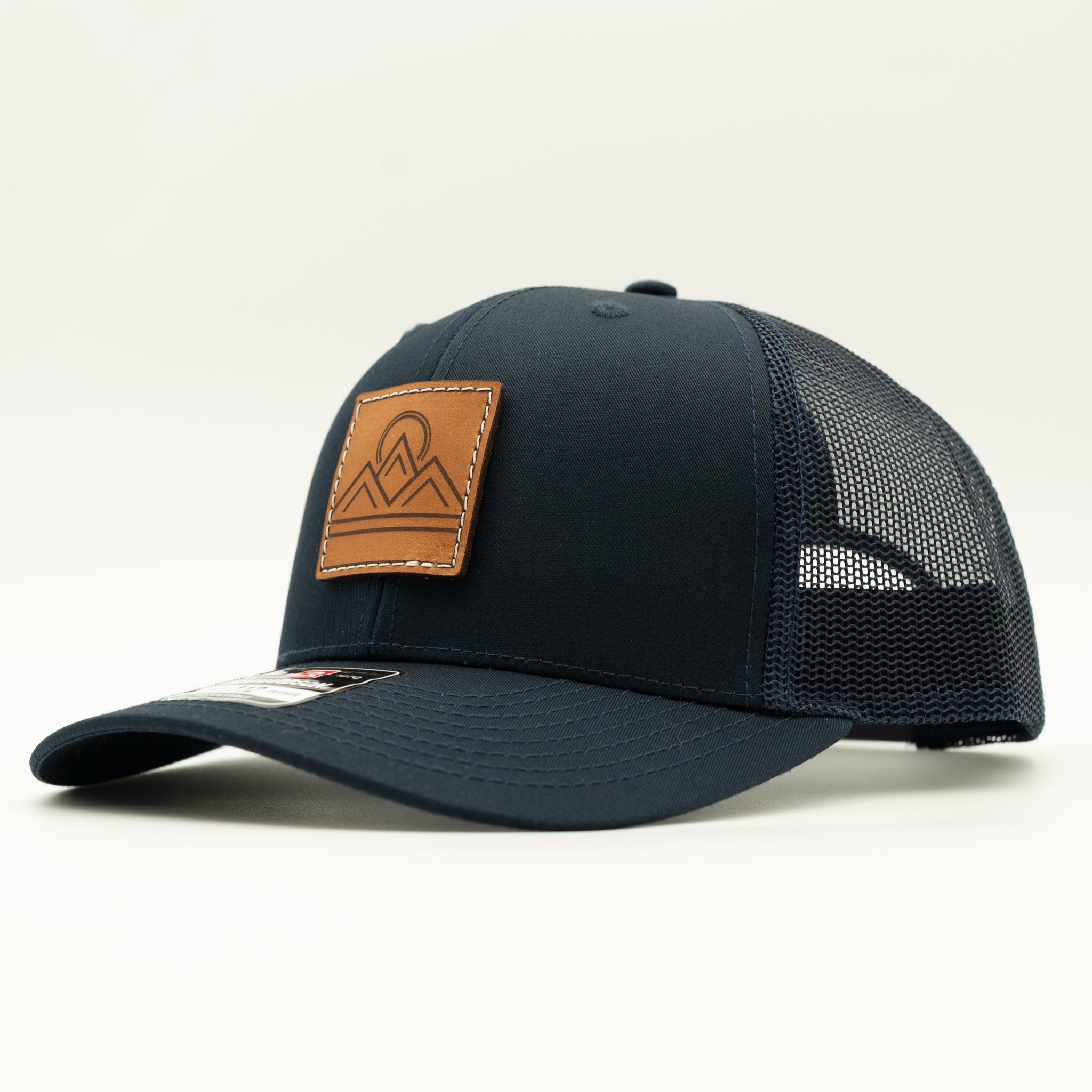 Side view of Lunar Ridge navy Richardson 112 leather patch mountain hat with matching navy mesh back
Color: Navy/Navy