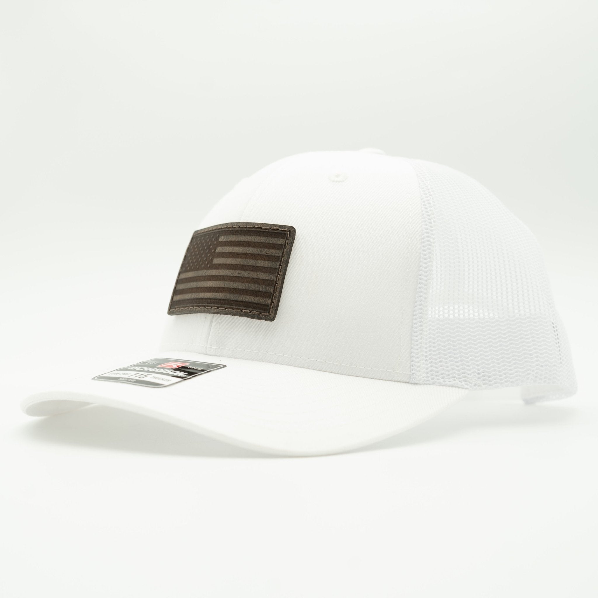 White cap with a brown flag patch on a light gray background
Color: Solid White