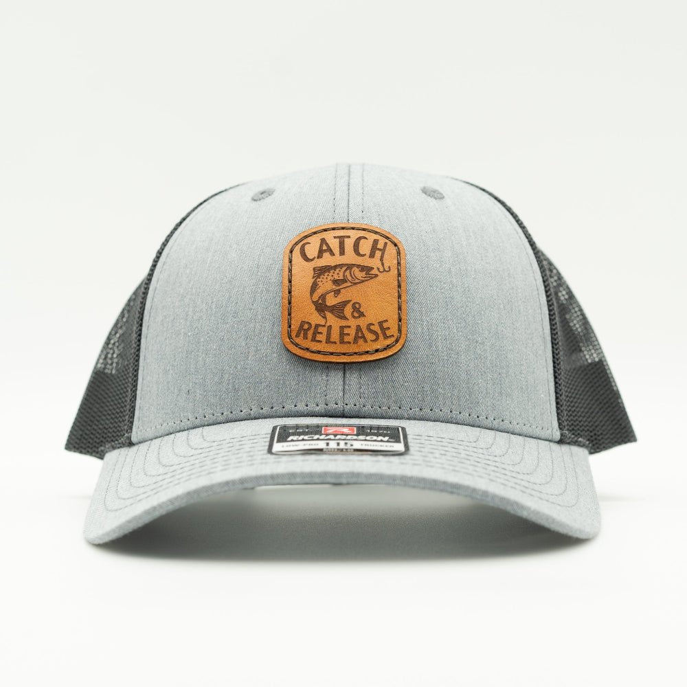 Front view of heather grey Richardson 115 low profile trucker hat with Catch & Release fish and hook patch.
Color: Heather Grey/Charcoal