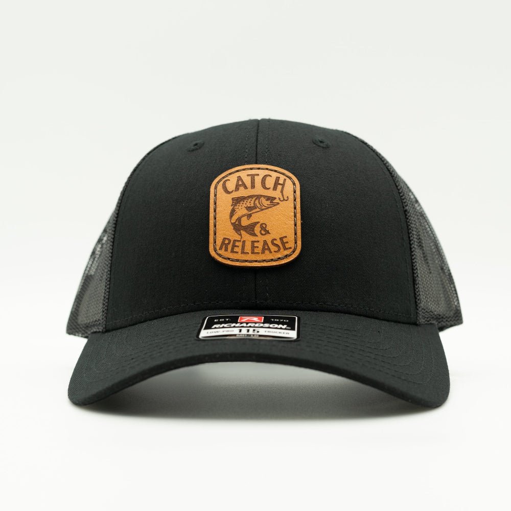 Front view of solid black Richardson 115 low profile fishing hat with Catch & Release leather patch and curved visor.
Color: Solid Black