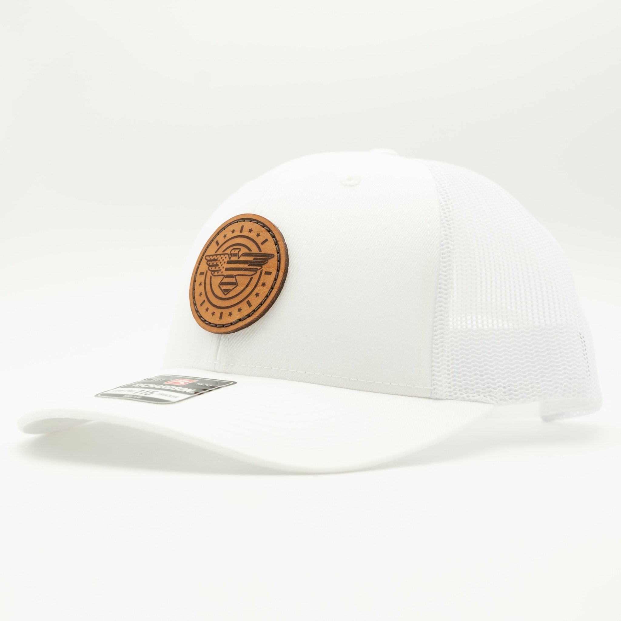 White cap with a brown leather patch on a light gray background
Color: Solid White