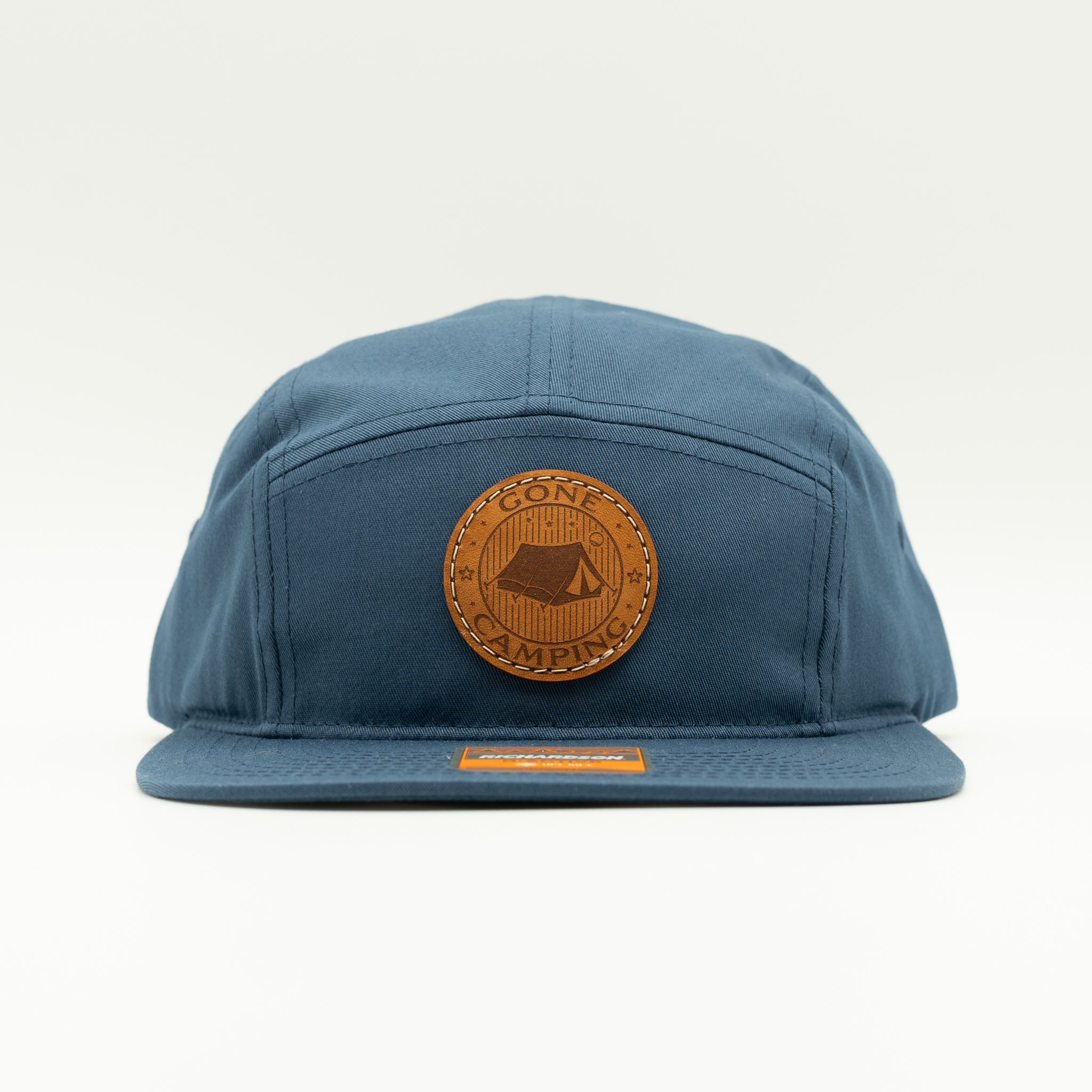Front view of light navy Richardson 217 camper hat with round Gone Camping tent leather patch.
Color: Light Navy