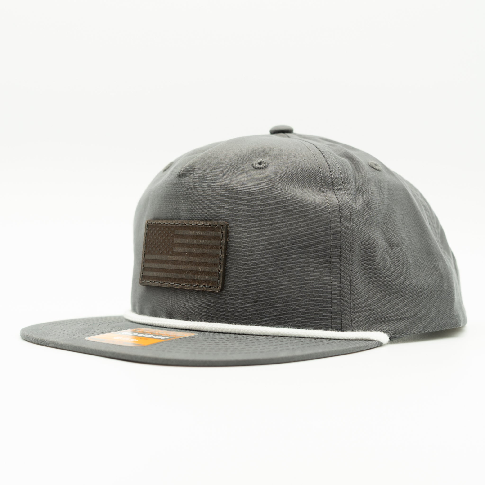 Charcoal Richardson 256 rope hat with charcoal leather American flag patch, flat bill snapback.
Color: Charcoal/White