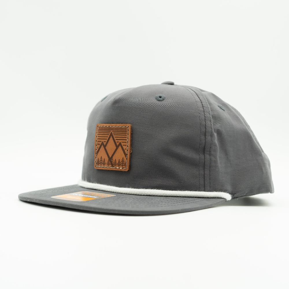 Side view of charcoal Mountain West leather patch rope hat on Richardson 256, highlighting engraved mountain patch, clean side panel, and rope bill.