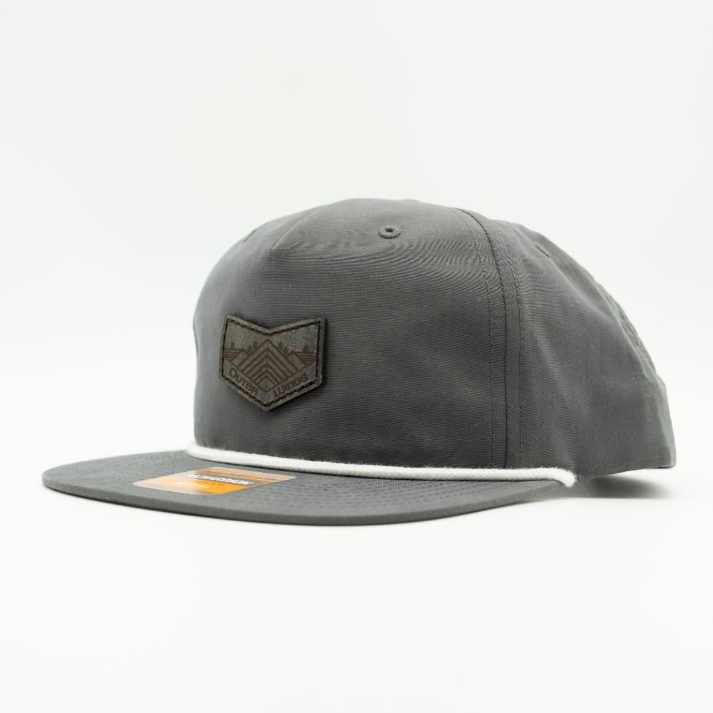 Side view of charcoal Richardson 256 rope hat snapback, flat bill rope detail, low profile crown, sewn leather Midnight Mountain patch.