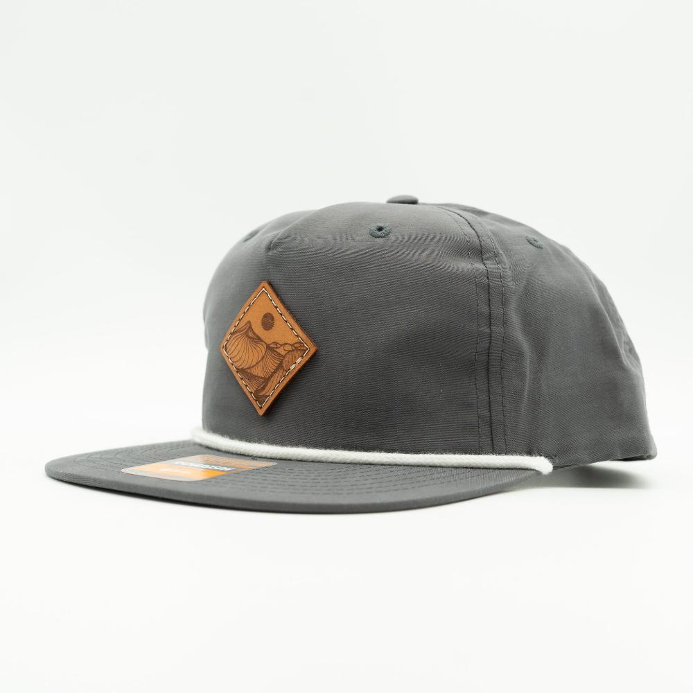 Side view of charcoal Richardson 256 Desert Mountain rope hat with veg-tan leather patch and white rope, low profile flat bill.
Color: Charcoal/White