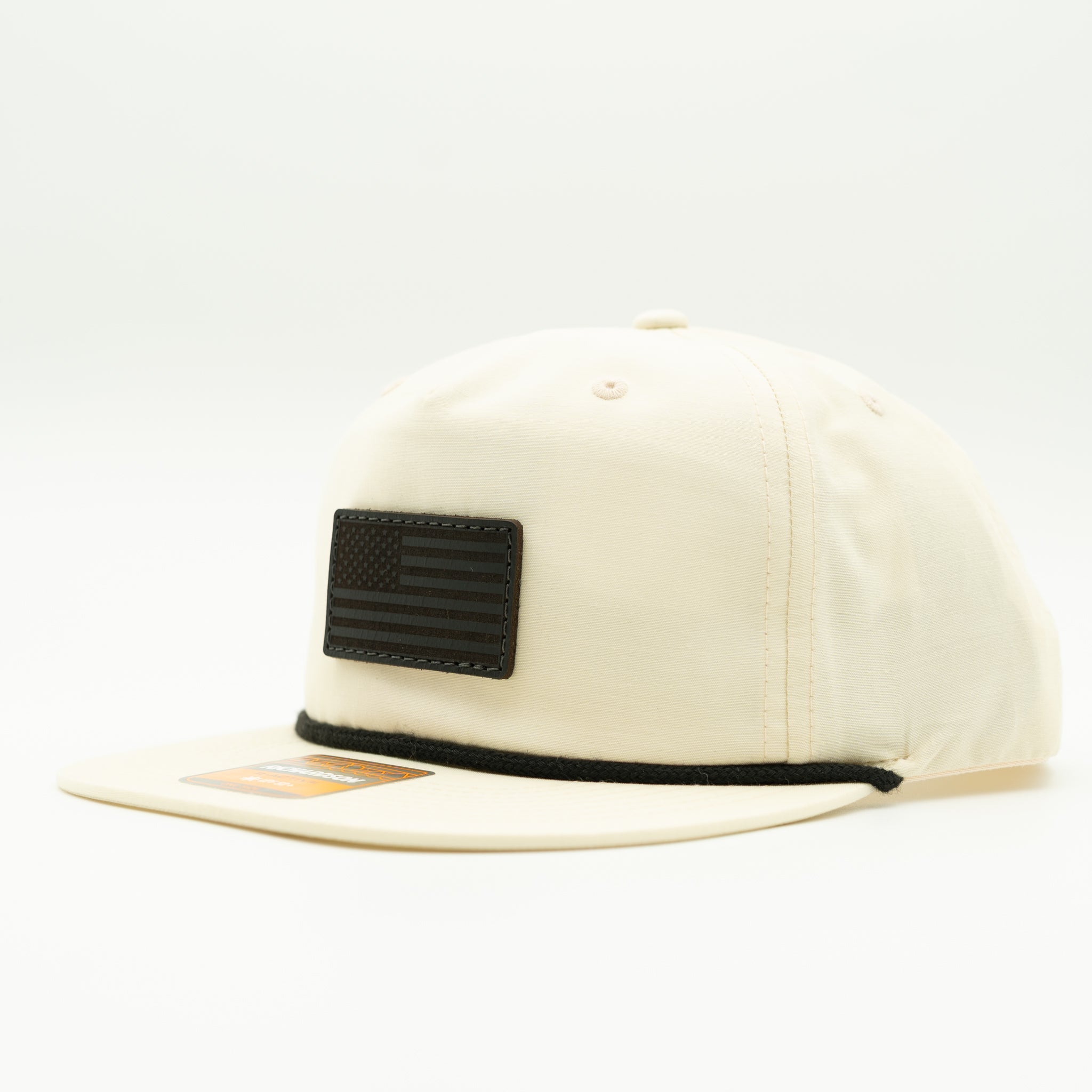 Birch Richardson 256 American flag rope hat with black leather patch, flat bill and rope trim.
Color: Birch