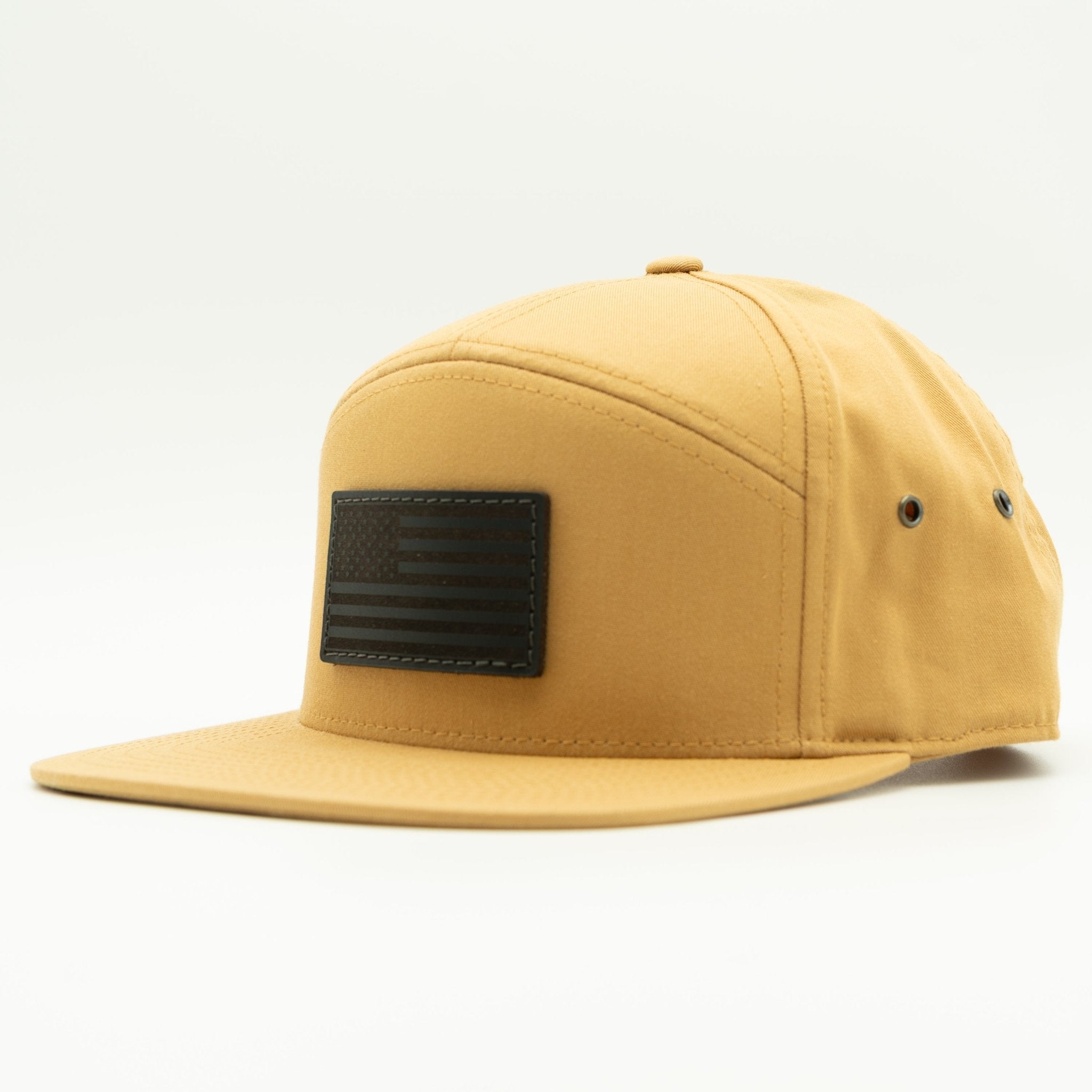 Yellow cap with a black patch on a white background
Color: Biscuit