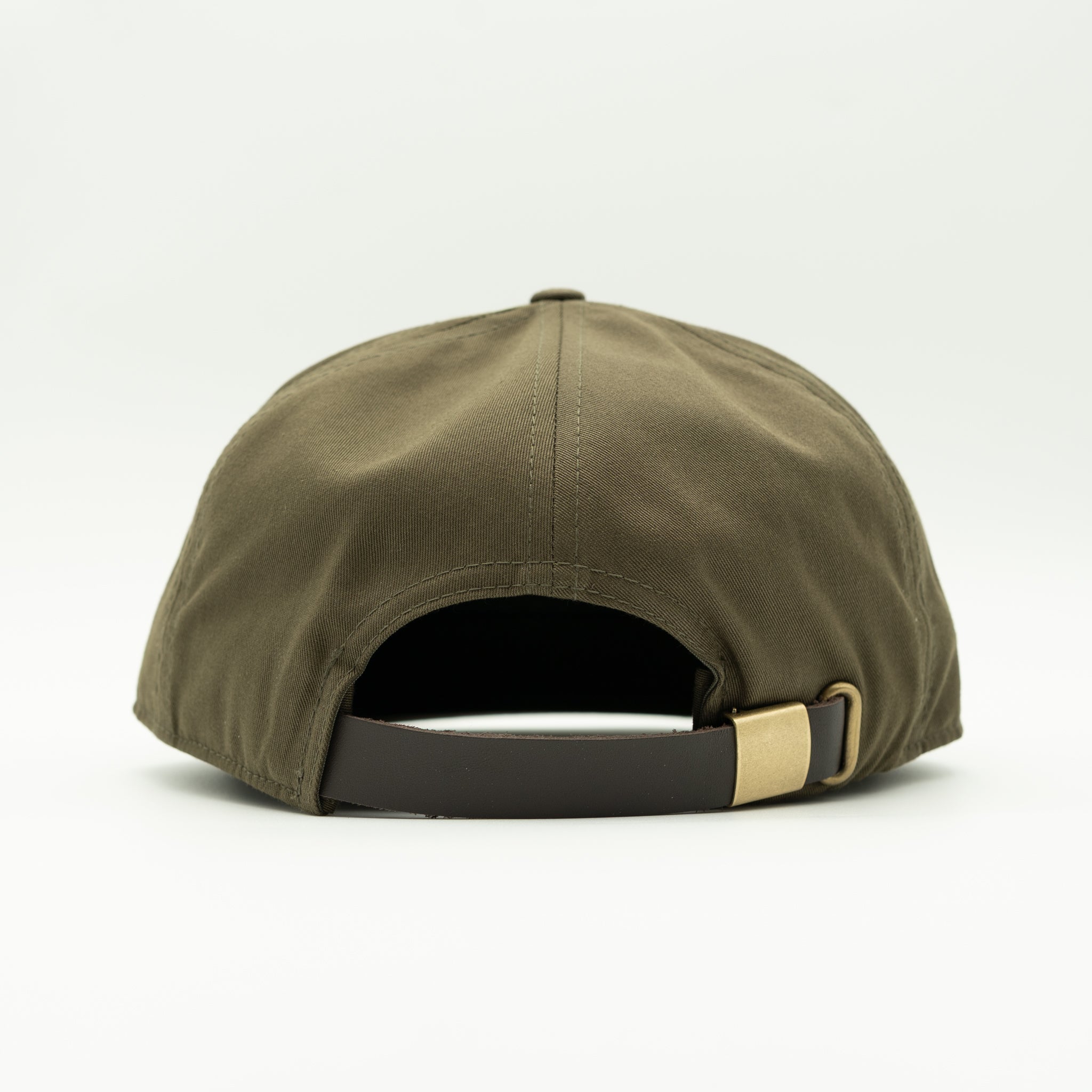An olive green baseball cap shown from the back, featuring a dark brown adjustable strap with a gold metal buckle.
Color: Olive