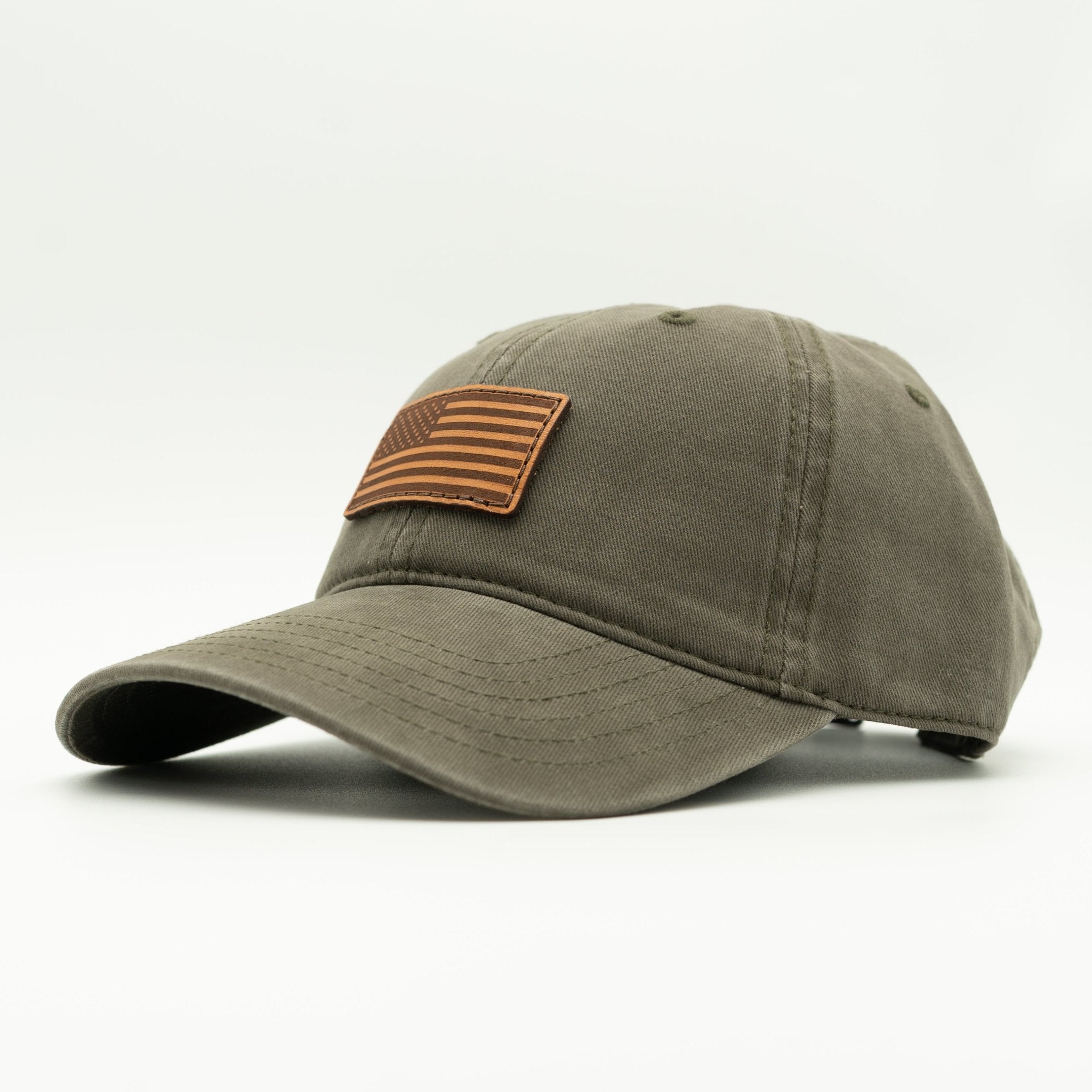 Green baseball cap with a brown leather patch on a white background
Color: Olive