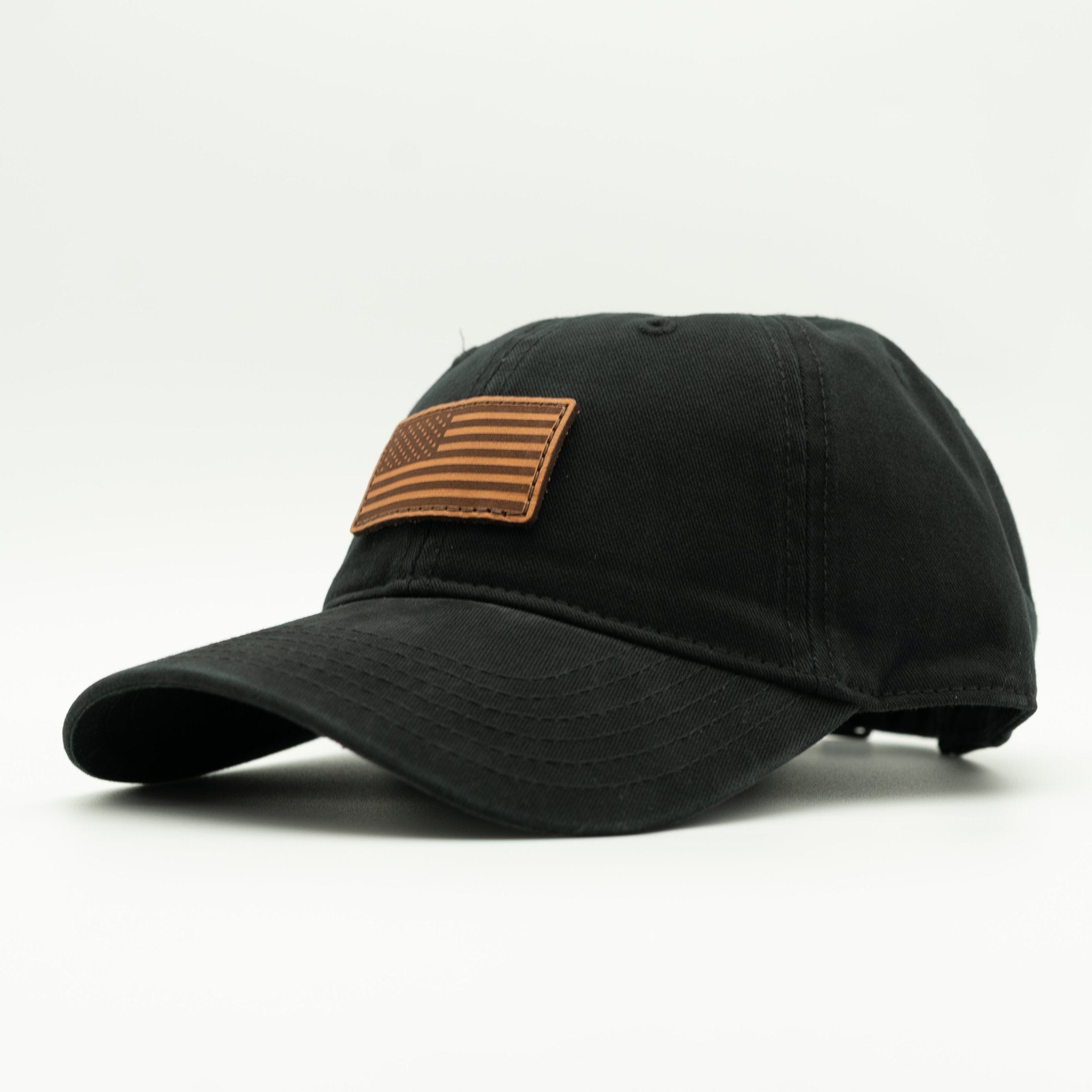 Black cap with a brown flag patch on a white background
Color: Black