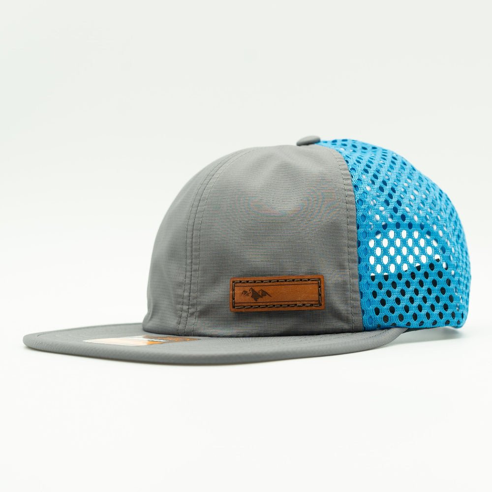 Charcoal and cyan Richardson 935 performance hat side view with leather Active Mountain patch, water resistant mesh back mountain hats style
Color: Charcoal/Cyan