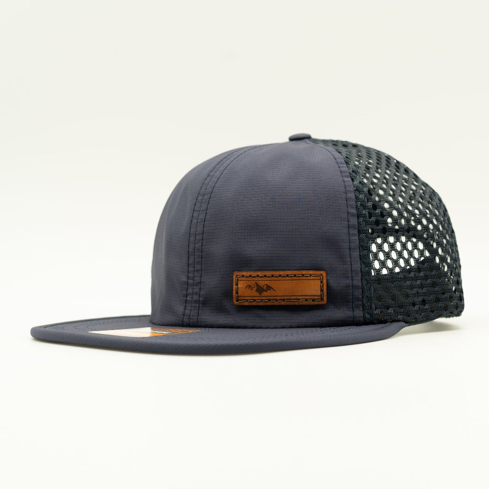 Navy Richardson 935 performance hat side view with brown leather Active Mountain patch and dark mesh back, water resistant leather patch mountain hat
Color: Navy/Navy