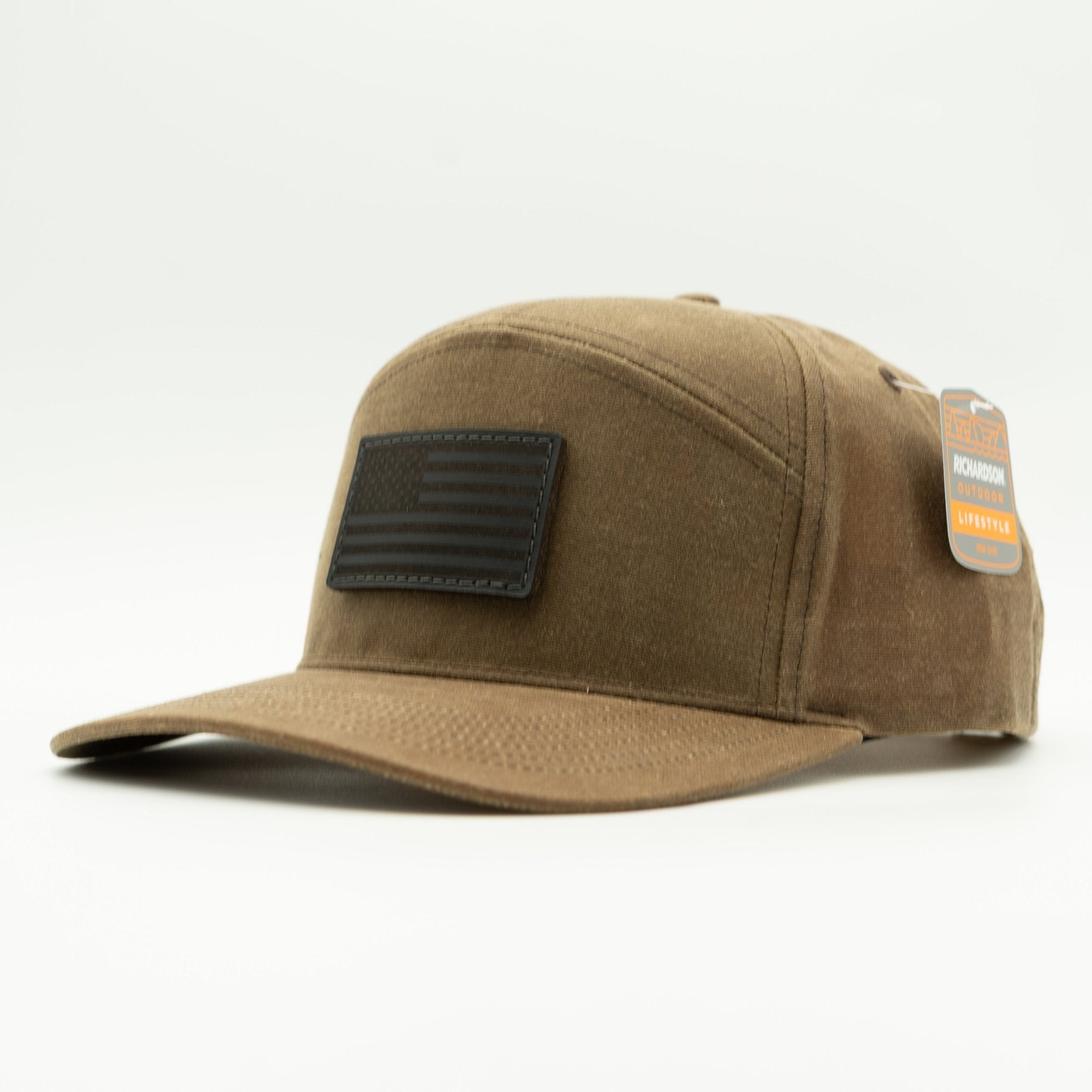Brown cap with a black flag patch on a white background
Color: Buck