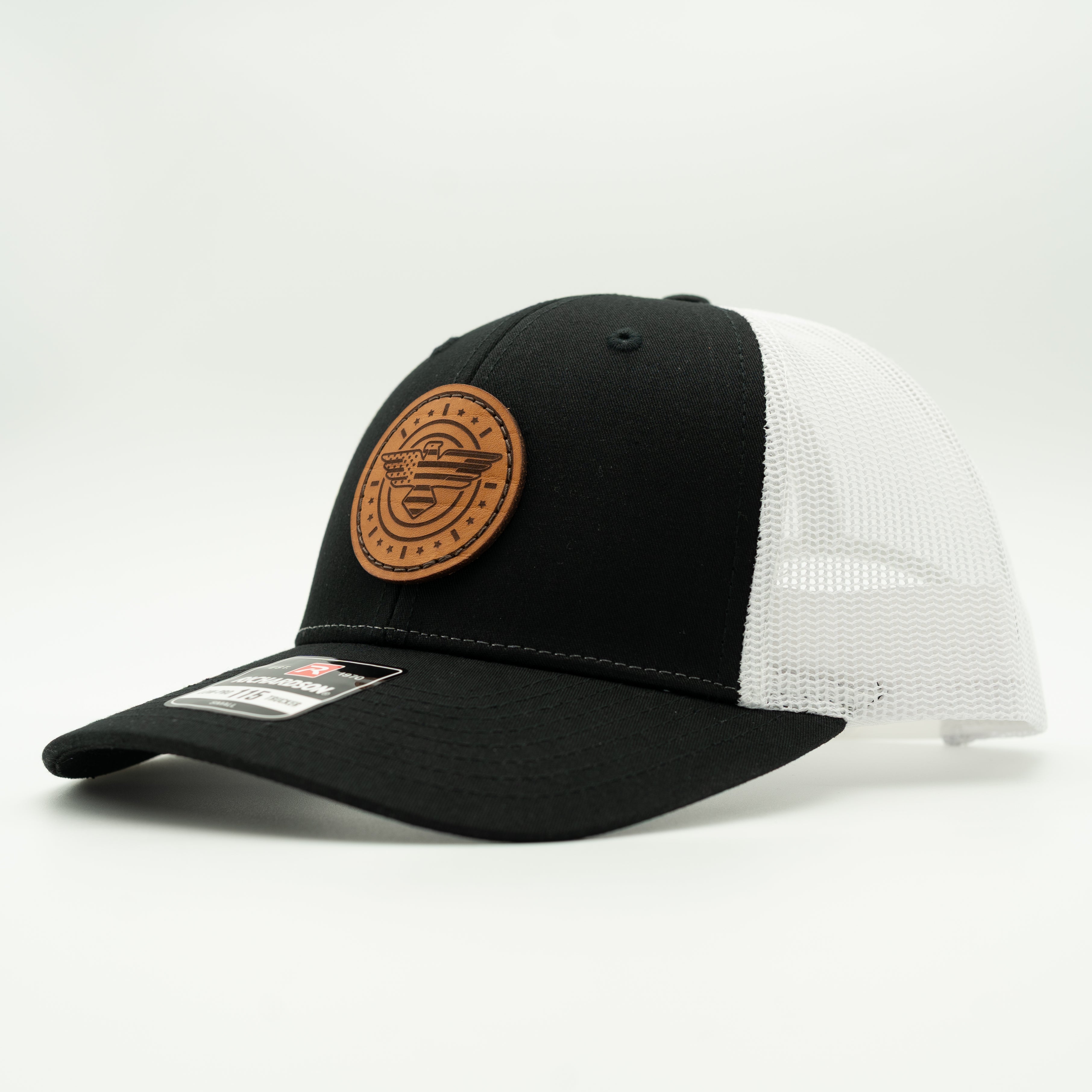 Black and white trucker cap with a brown leather patch on a light gray background


Color: Black/White