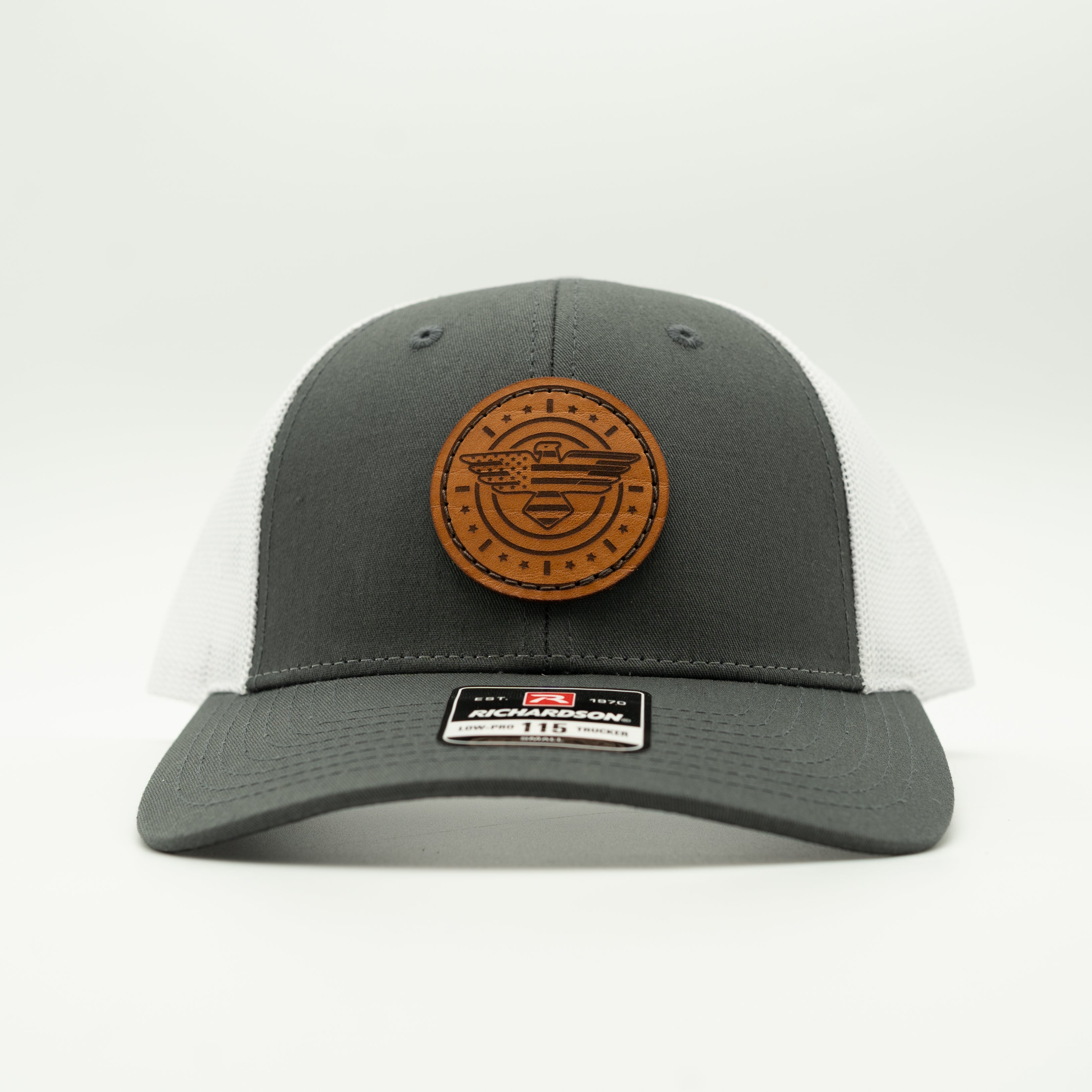 Gray and white cap with a brown logo on a light gray background

Color: Charcoal/White