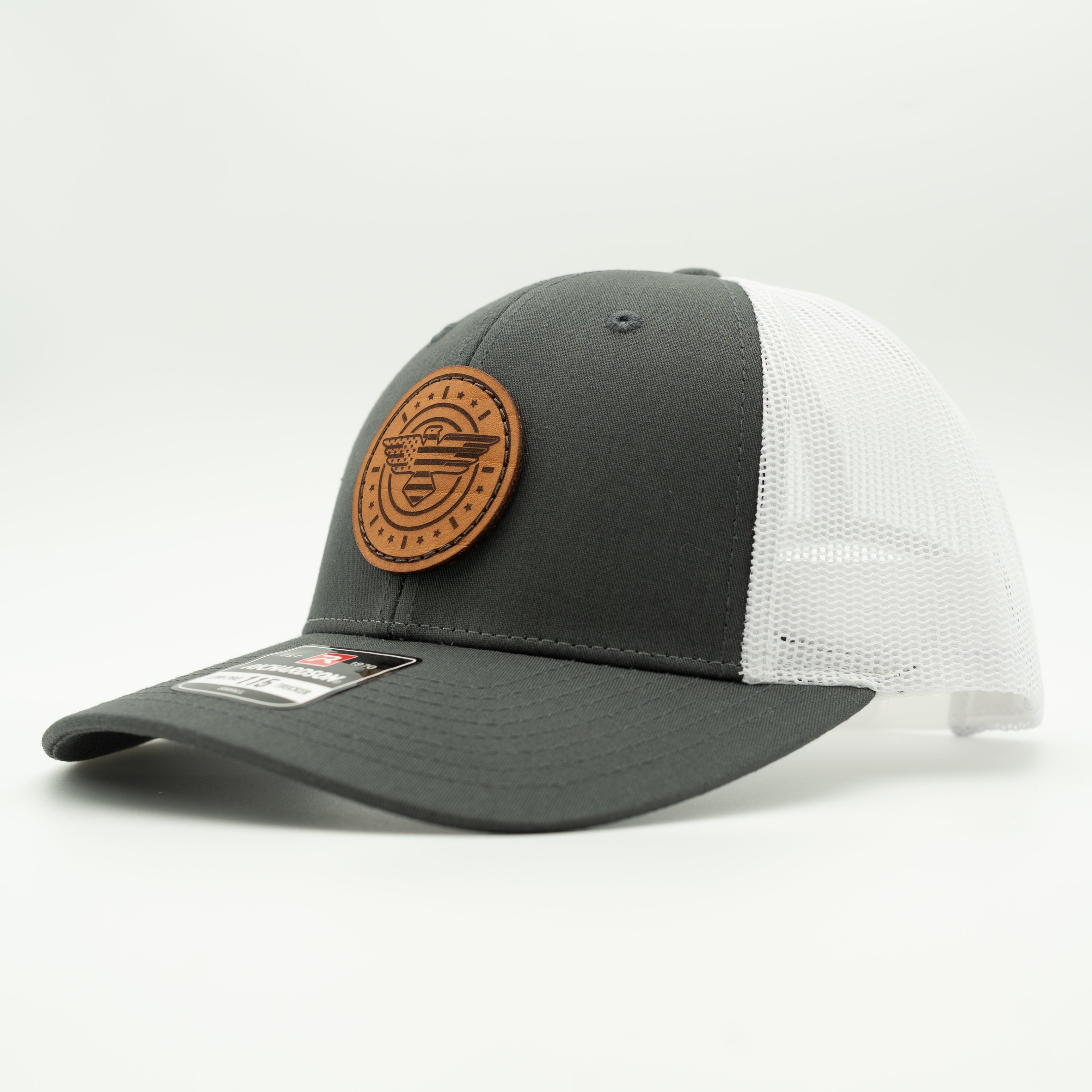 Gray and white cap with a brown leather patch on a light gray background

Color: Charcoal/White