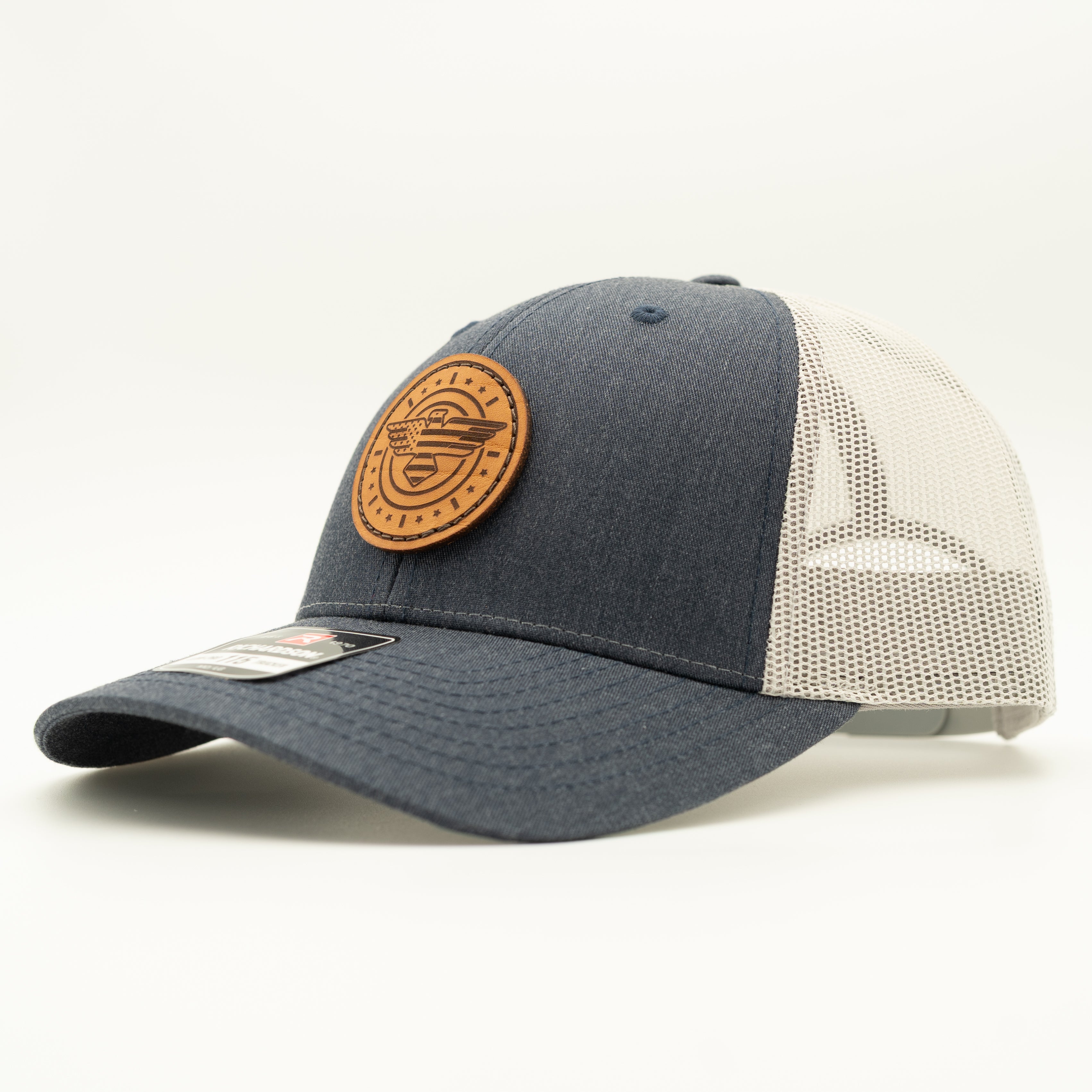 Blue and beige cap with a brown leather patch on a white background

Color: Heather Navy/Grey
