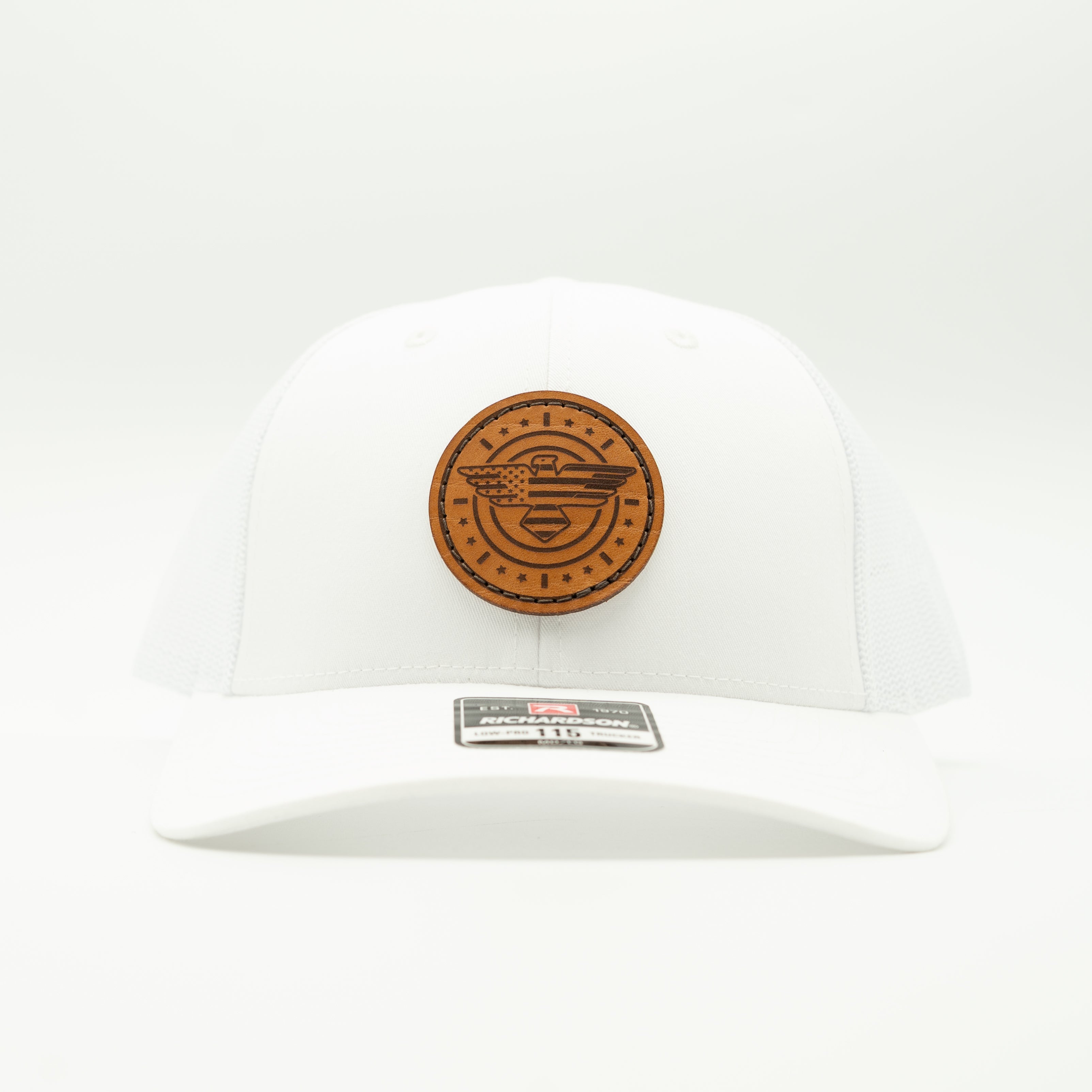 White cap with a brown leather patch on a white background

Color: Solid White