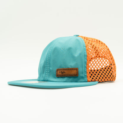 Side view of Richardson 935 hat in teal/orange, emphasizing the hat’s lightweight, water-resistant properties.