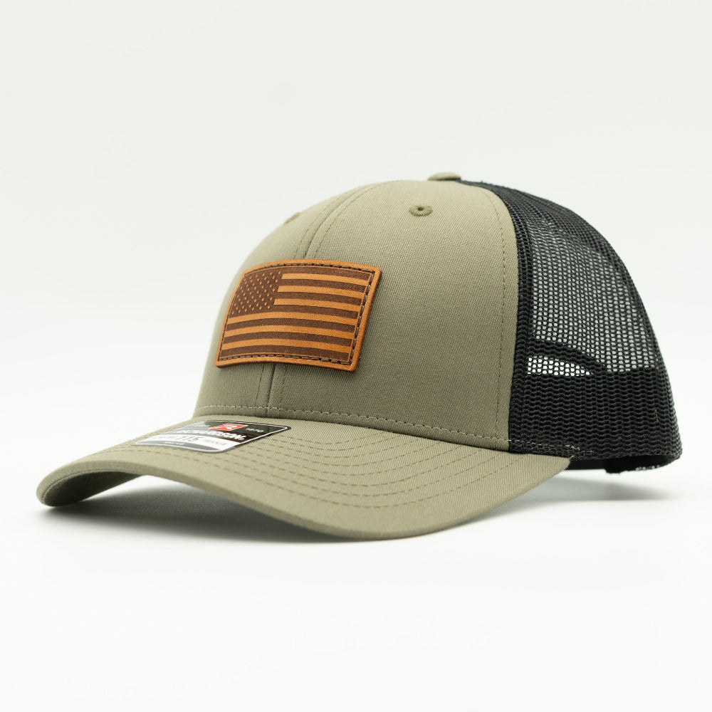 Side view of the Loden/Black American Flag Hat, highlighting the black mesh back and snapback closure, with the American Flag leather patch visible from the side.