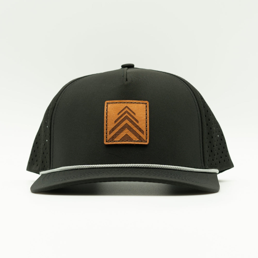 Front view of the Arrow Pine Hat by Outer Wings in black, crafted on a high-profile Outer Wings 970 hat with a square leather patch featuring a modern triple arrow design that doubles as a pine tree. This water-resistant hat combines style with functionality, offering a sleek and adventurous look.