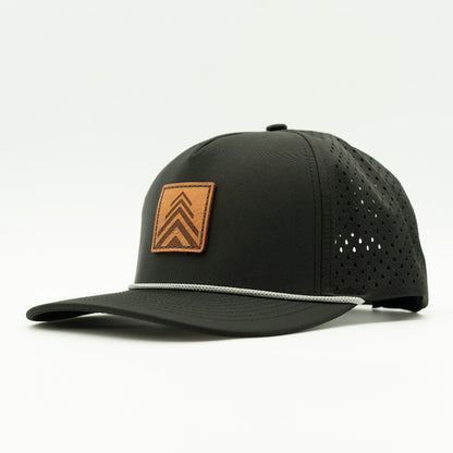 Side view of the Arrow Pine Hat by Outer Wings in black, showing the hat's structured high-profile silhouette, classic rope detail, and square patch with a triple arrow pine tree design. The water-resistant material and adjustable snapback ensure a comfortable fit for outdoor activities.