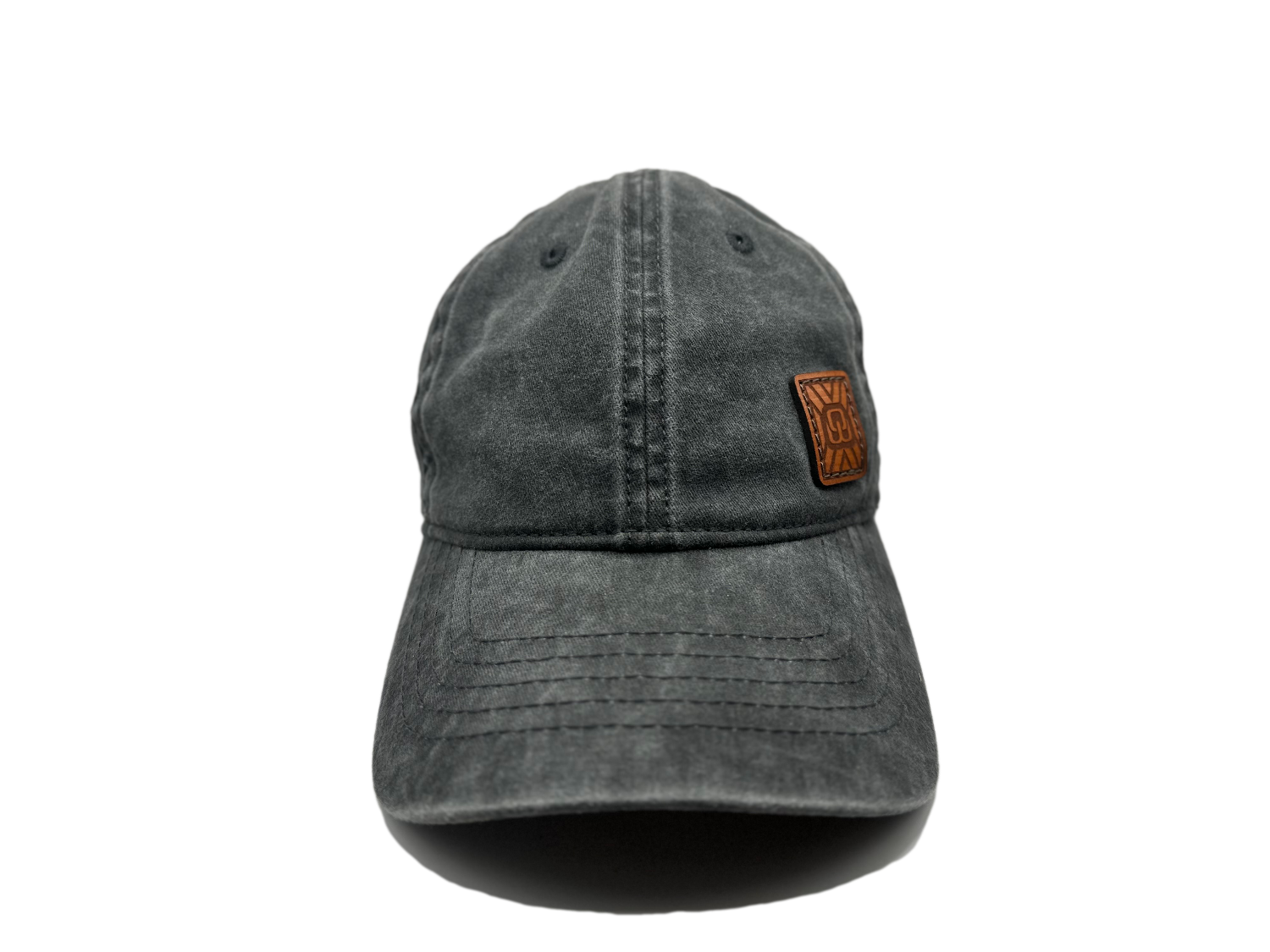 Women's baseball hat with leather patch. Our custom designed leather patch is laser engraved and sewn onto a women's cap. We use full-grain, veg tanned leather. Women's hats have a hidden pony tail opening and makeup resistant band.