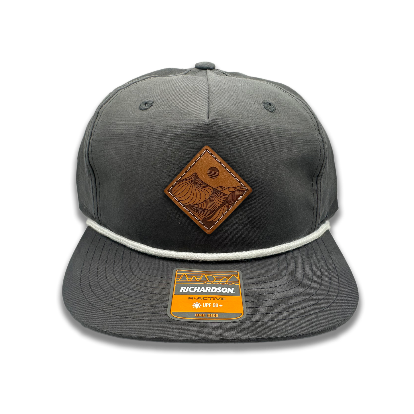 Get a taste of rugged charm with the Charcoal Richardson 256 Rope Umpqua Hat. Made in Colorado, USA, this low profile SnapBack cap features a stylish Desert Mountain patch design. The genuine leather patch, laser engraved and sewn on, adds a touch of sophistication to this flatbill hat crafted from lightweight material.