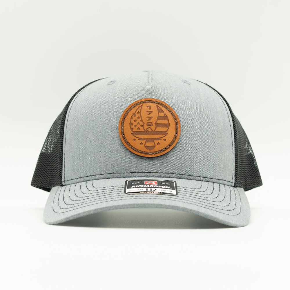 Custom Heather Grey Richardson Leather Patch hat. Our custom designed leather patch is laser engraved and sewn onto a Richardson 112 Hat. We use full-grain, veg tanned leather. Our custom leather patches are handmade and designed in Colorado, USA.