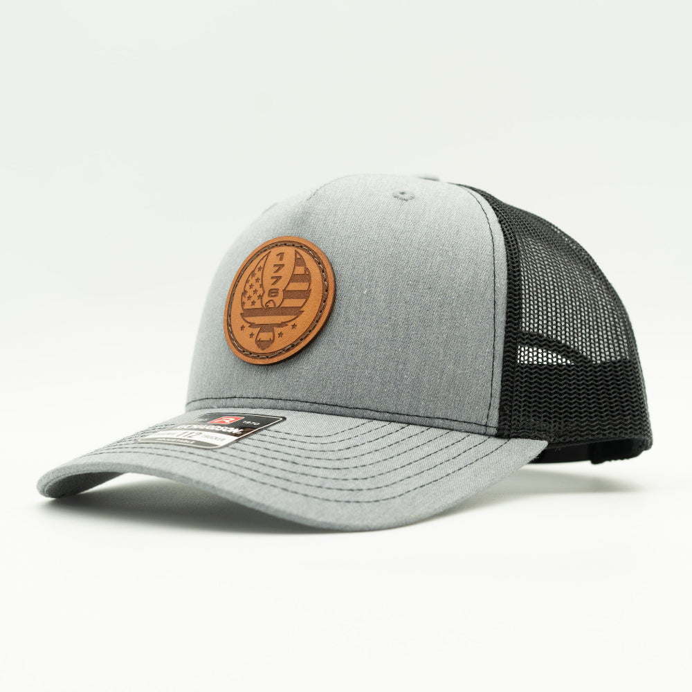 Custom Heather Grey Richardson Leather Patch hat. Our custom designed leather patch is laser engraved and sewn onto a Richardson 112 Hat. We use full-grain, veg tanned leather. Our custom leather patches are handmade and designed in Colorado, USA.