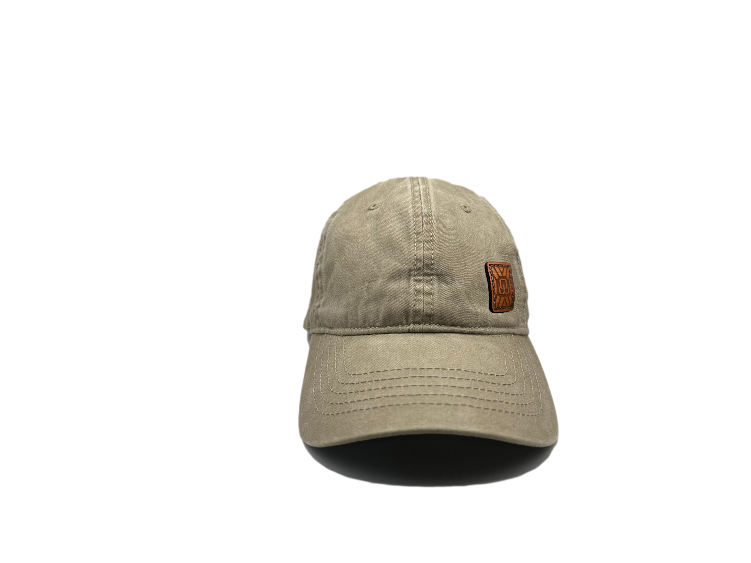 Women's baseball hat with leather patch. Our custom designed leather patch is laser engraved and sewn onto a women's cap. We use full-grain, veg tanned leather. Women's hats have a hidden pony tail opening and makeup resistant band.