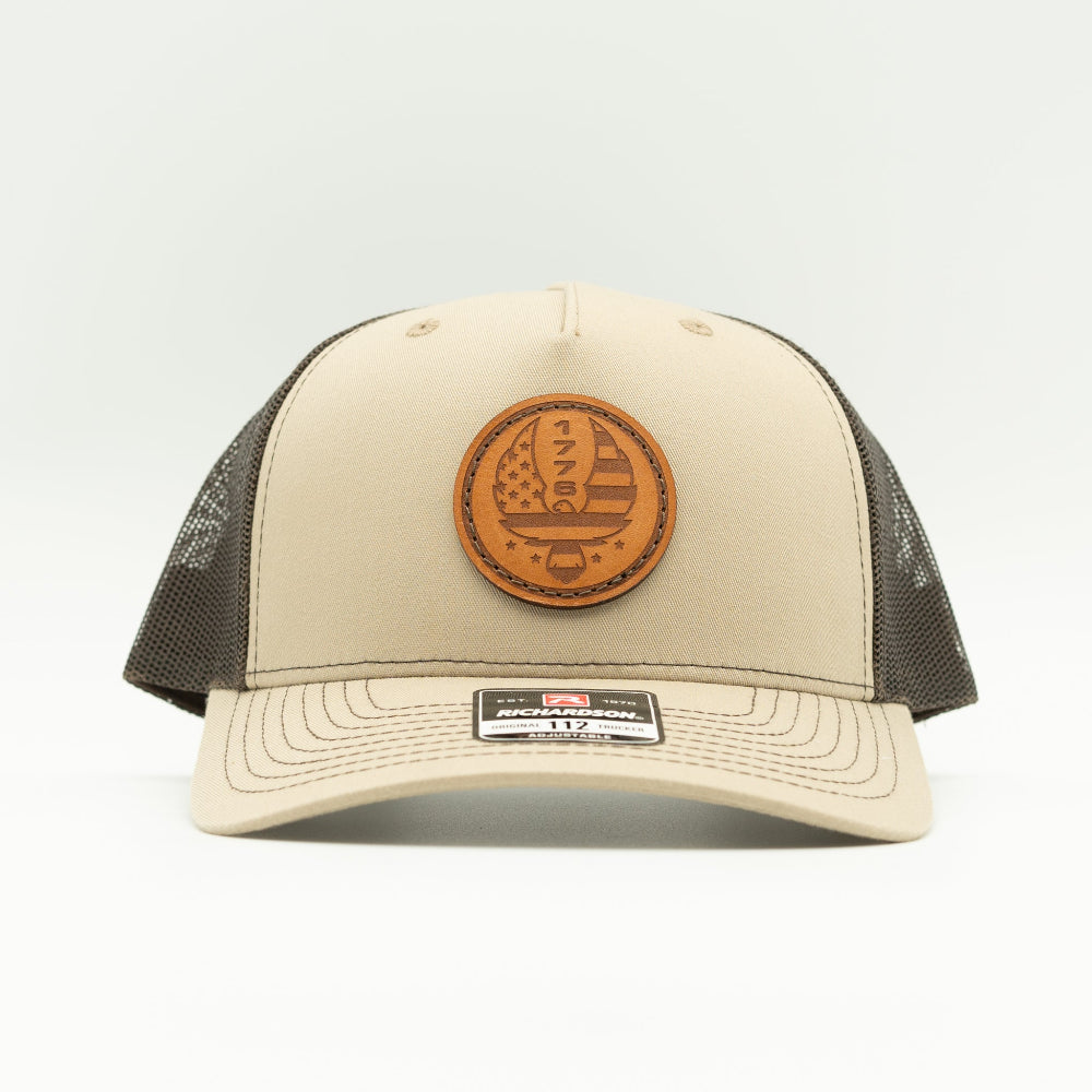 Custom Khaki/Brown Richardson Leather Patch hat. Our custom designed leather patch is laser engraved and sewn onto a Richardson 112 Hat. We use full-grain, veg tanned leather. Our custom leather patches are handmade and designed in Colorado, USA