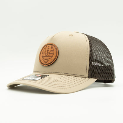 Custom Khaki/Brown Richardson Leather Patch hat. Our custom designed leather patch is laser engraved and sewn onto a Richardson 112 Hat. We use full-grain, veg tanned leather. Our custom leather patches are handmade and designed in Colorado, USA.