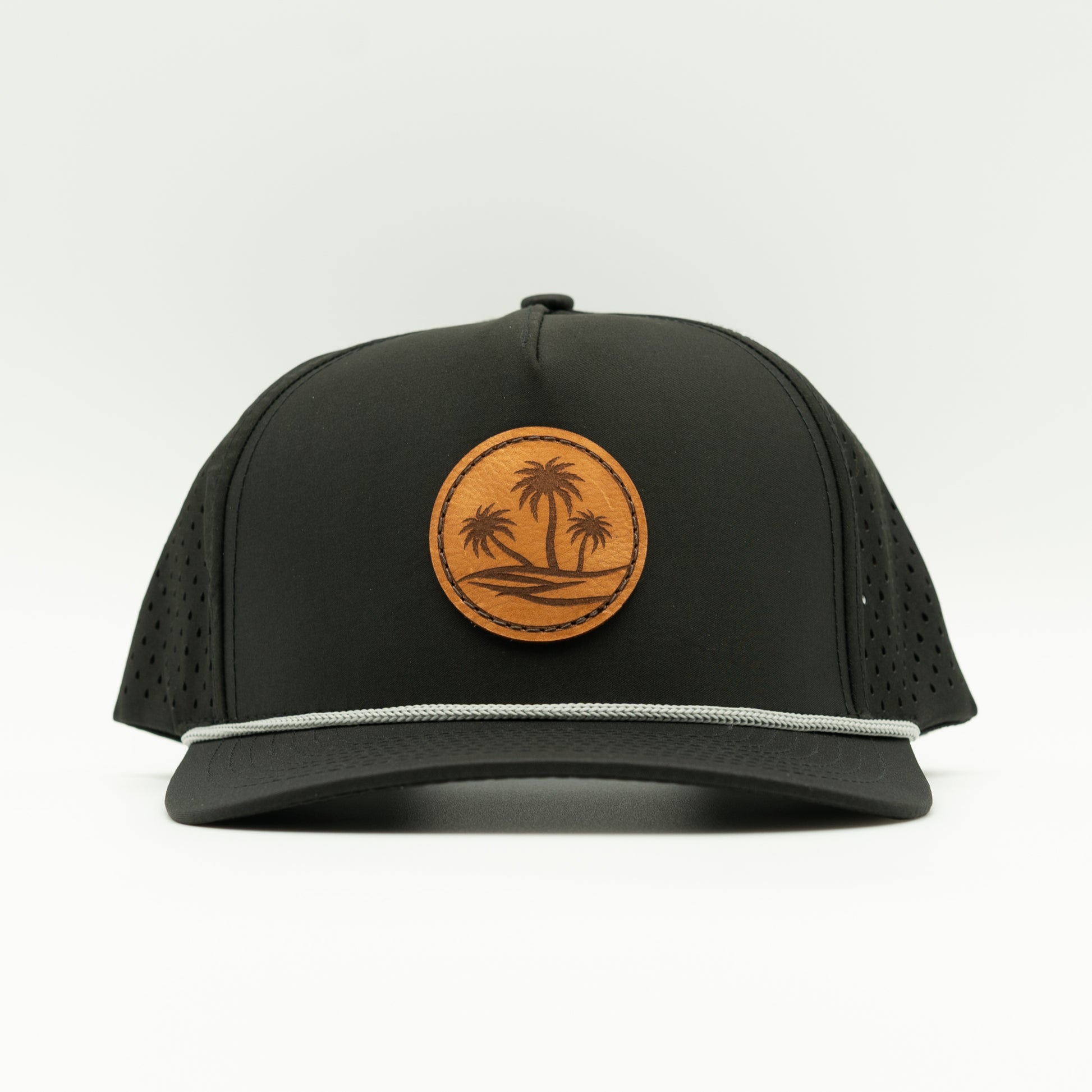 Front view of the Oasis Hat by Outer Wings in black, showing the classic rope detail, structured profile, and adjustable snapback. Perfect for outdoor enthusiasts seeking a stylish, high-profile hat.