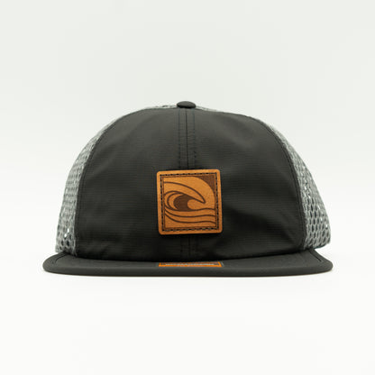 Front view of the Ocean Swell Hat by Outer Wings in Black/Charcoal, highlighting the unstructured build, wide-set mesh back, and adjustable backstrap. A lightweight and breathable performance hat ideal for all adventures.