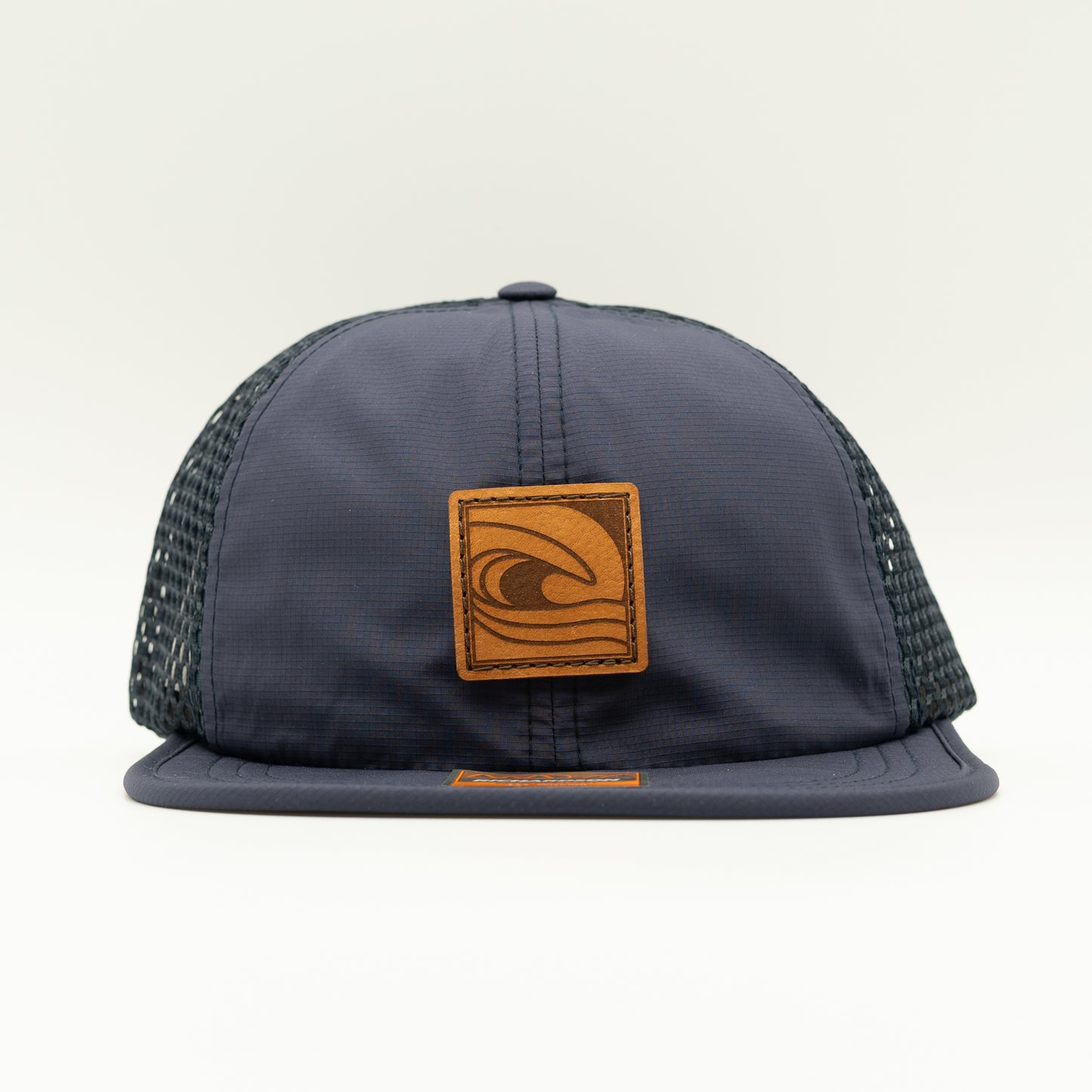 Front view of the Ocean Swell Hat by Outer Wings in Navy/Navy, highlighting the breathable mesh back, flex packable visor, and quick adjust webbing backstrap. A performance hat that combines style and function.