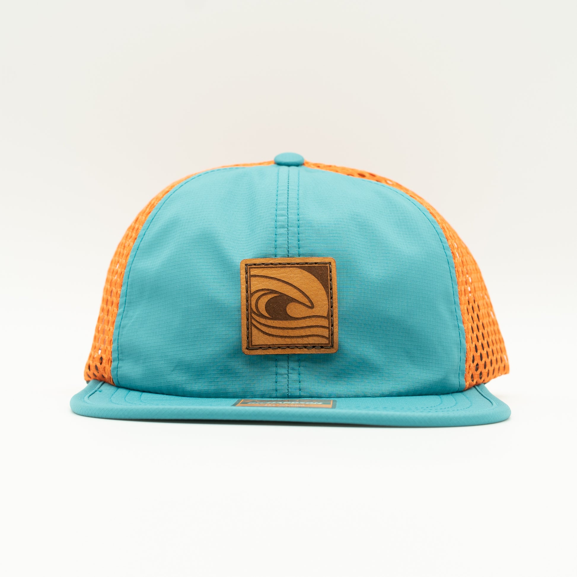 Front view of the Ocean Swell Hat by Outer Wings in Teal/Orange, showing the wide-set mesh back, adjustable backstrap, and flexible visor. A lightweight, breathable outdoors hat for any adventure.