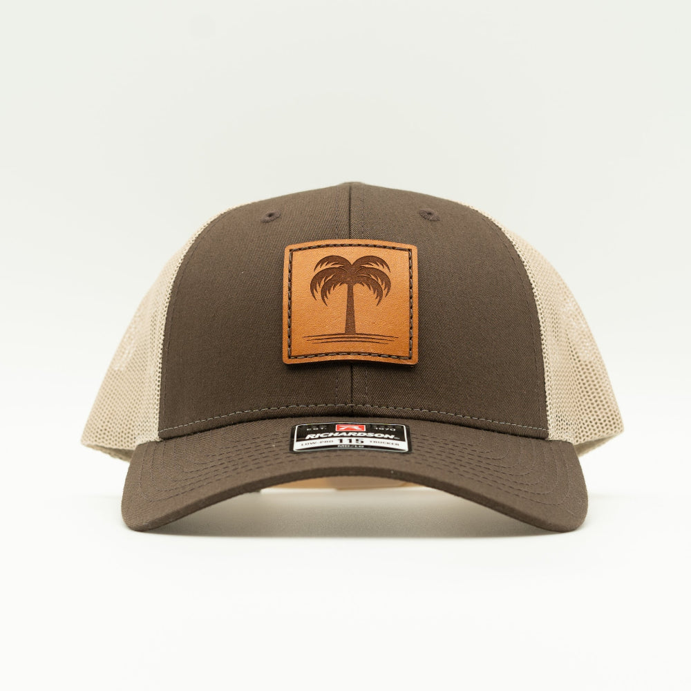 Front view of the Solo Palm Leather Patch Hat by Outer Wings in Brown/Khaki, highlighting the mesh back, adjustable SnapBack, and structured profile. A rugged yet stylish custom leather patch hat for all your outdoor activities.