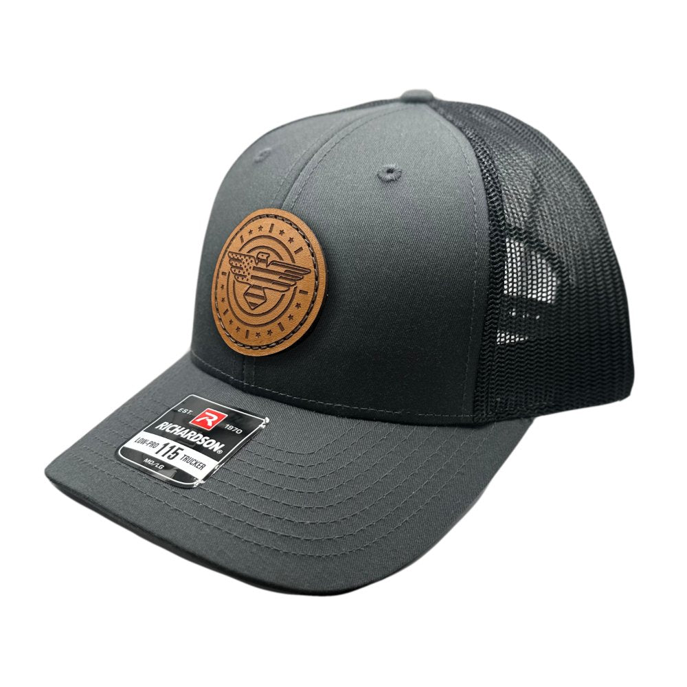 Side view of the American Eagle Design leather patch hat by Outer Wings in charcoal/black, highlighting the low-profile structure, adjustable SnapBack, and detailed leather patch with an eagle, flag, stars, and stripes. Designed for comfort and a patriotic style.