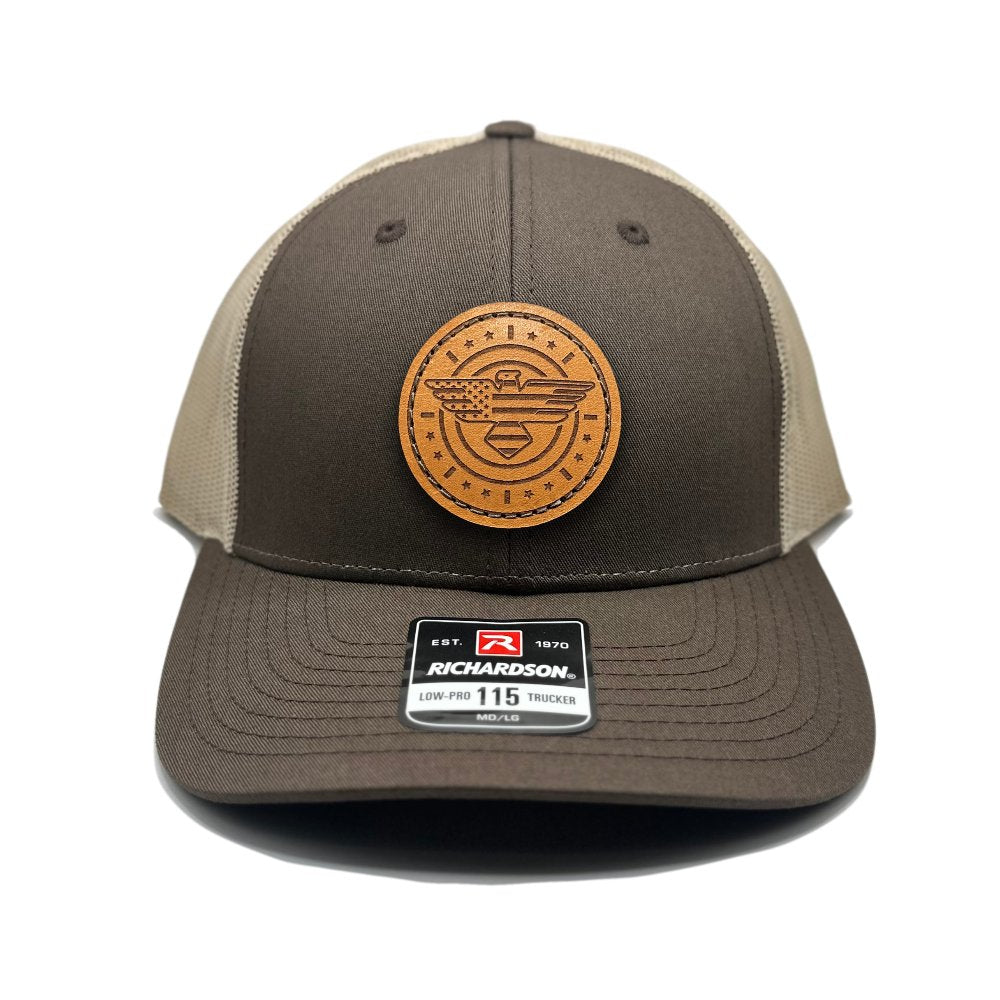 Front view of the American Eagle Design leather patch hat by Outer Wings in brown/khaki, featuring a low-profile Richardson 115 hat with a leather patch showcasing an eagle, American flag, stars, and stripes. The brown front and khaki mesh create a warm, earthy look, perfect for any occasion.