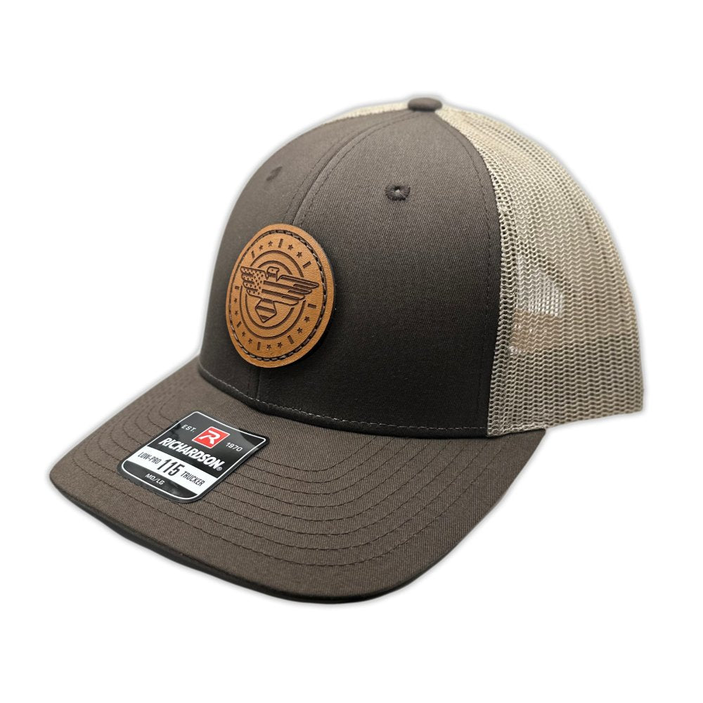 Side view of the American Eagle Design leather patch hat by Outer Wings in brown/khaki, emphasizing the hat's comfortable low-profile fit and adjustable SnapBack. The handcrafted leather patch, featuring an eagle motif with flag details, is sewn for added durability.