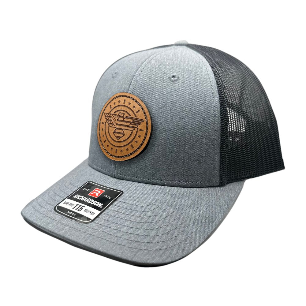 Side view of the American Eagle Design leather patch hat by Outer Wings in heather grey/dark charcoal, showcasing the hat's low-profile design and adjustable SnapBack. The detailed leather patch, highlighting an eagle with flag elements, offers a perfect blend of style and patriotism.