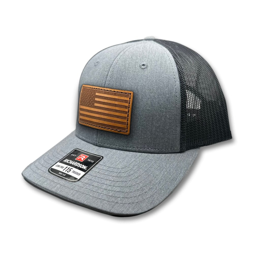 Side view of the Heather Grey/Charcoal American Flag Hat, showing the charcoal mesh back and snapback closure, with the American Flag leather patch visible from the side.