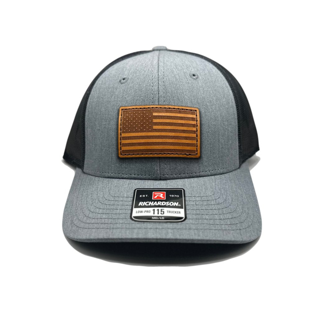 Heather Grey/Charcoal American Flag Hat by Richardson 115 with a genuine leather American Flag patch, laser-engraved and hand-sewn, on a heather grey and charcoal trucker hat.